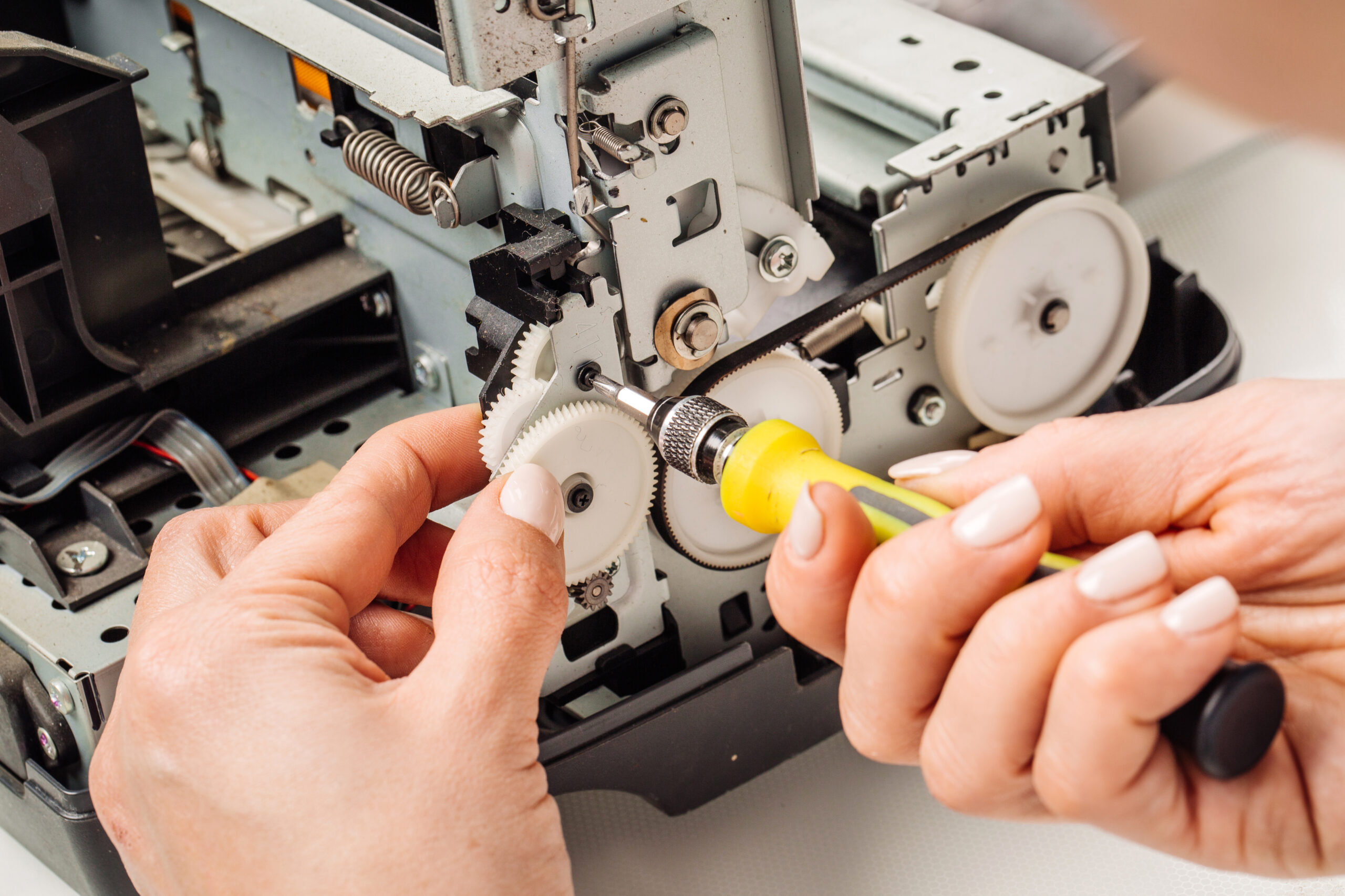 technician repairing digital printer